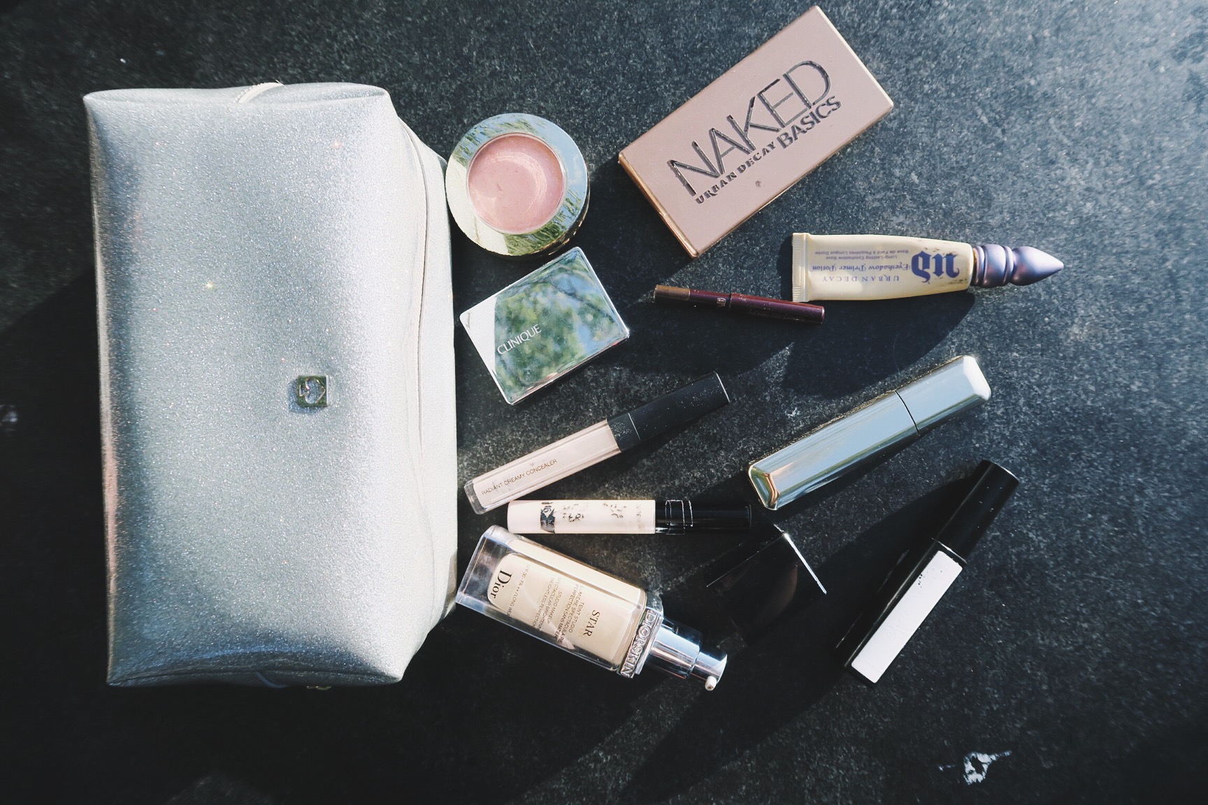 The contents of Anna's travel makeup bag
